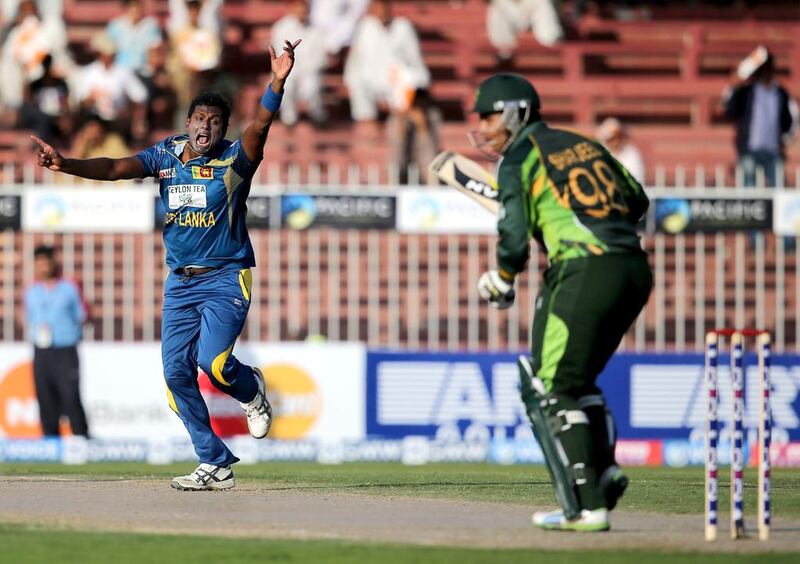 Sri Lanka’s Angelo Mathews, left, appeals a wicket against Pakistan in Sharjah on Wednesday. Francois Nel / Getty Images

