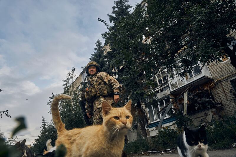 A Ukrainian soldier in Izium, Kharkiv region, Ukraine. Ukrainian troops piled pressure on retreating Russian forces on Tuesday, pressing deeper into occupied territory and sending more Kremlin troops fleeing from the counteroffensive that has inflicted a stunning blow on Moscow's military prestige. AP