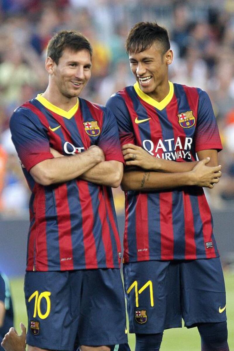 Despite Barcelona's successes so far this season, injuries, off-field woes and perhaps even the arrival of a new, young star in Neymar, right, mean Lionel Messi, left, has not had much to smile about in 2013. Quique Garcia / AFP