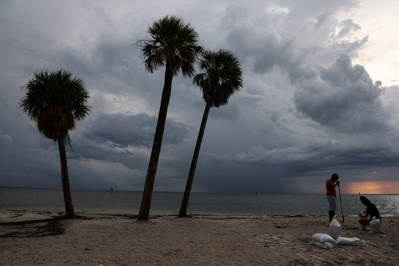 Florida residents fill sandbags as Hurricane Ian sped towards the state. Reuters