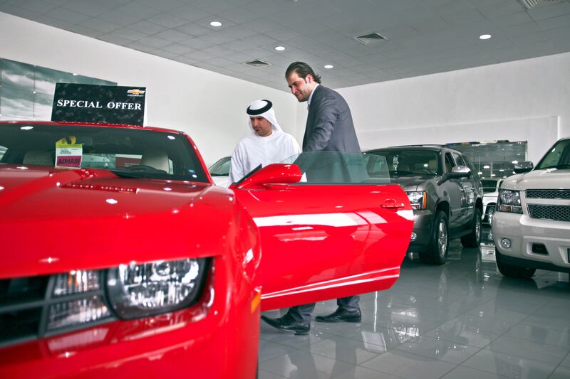 April 10, 2012, Abu Dhabi, UAE:
The Chevrolet showroom is located on 31st street, between 2nd and 4th, across from the Holiday Inn. The dealership offers standard cars all the way up to the higher end of the brand, like a Camaro, for example. 

Bashar Al Haddad and Mohammed Al Hamadi (in Kandora), browse through the Chevrolet showroom. Mr. Al Hamadi ended up purchasing a pick up truck.

Lee Hoagland/The National