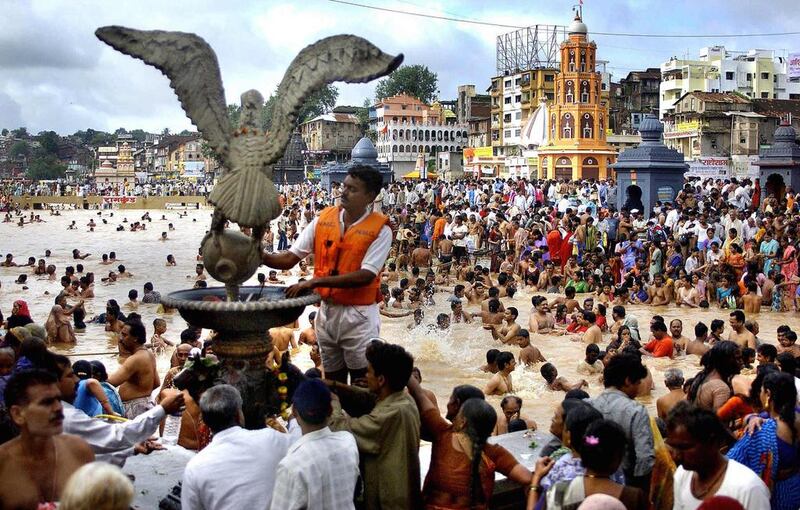 Hindu pilgrims on the banks of the Godavari River at Nashik during the Kumbh Mela festival on August 12, 2003. Organisers who are preparing for the festival that is will open on July 14, 20105 hope to avoid a repeat of a deadly stampede 12 years ago which kille 39 pilgrims Rob Elliott/AFP Photo