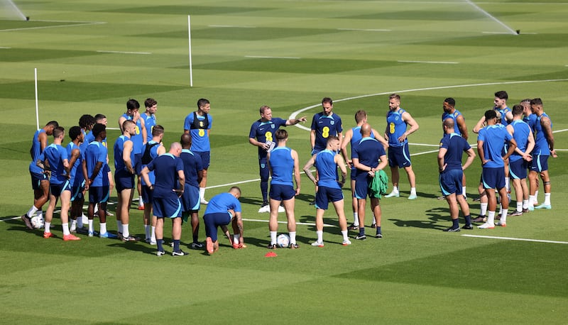 England manager Gareth Southgate and his assistant Steve Holland with the players at training. Reuters