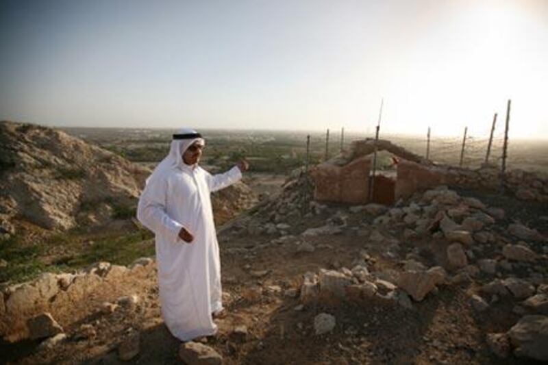Above left, Hamad bin Seray points out and explains the significance of the area.