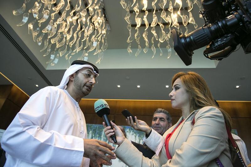 Abdullah Al Saleh, the undersecretary of the UAE Ministry of Economy, answers questions from the media at the sidelines of the 6th Annual Global UAE Investment Forum. Silvia Razgova / The National