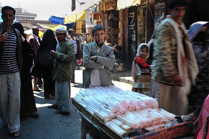 Rashid Adaad, 15, sells candles in the Old City of Sana'a. Photo: Lindsay Mackenzie for The National.