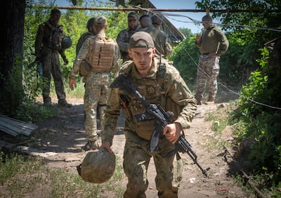 Ukrainian soldiers attend their positions in the Donetsk region. AP