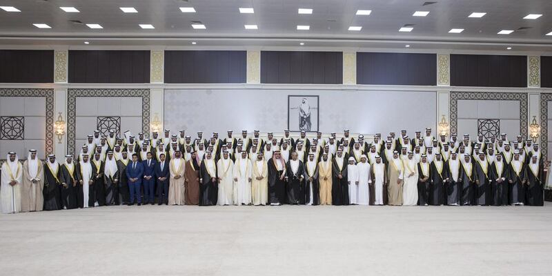 UAE rulers, leaders and dignitaries stand for a photograph with grooms during a mass wedding for Dr Sheikh Khaled bin Sultan bin Zayed Al Nahyan (20th L), at Mushrif Palace. Ryan Carter / Crown Prince Court - Abu Dhabi