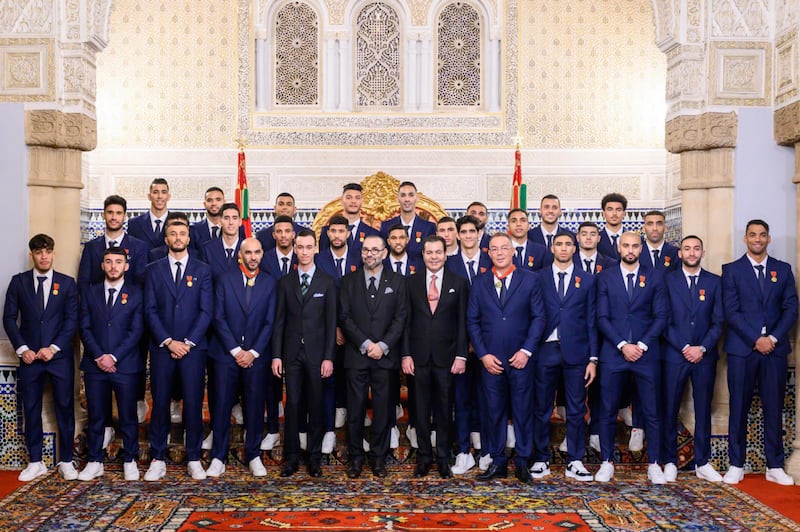 King Mohammed VI, Crown Prince Moulay El Hassan and Prince Moulay Rachid pose with the Moroccan national football team at the royal palace in Rabat. EPA