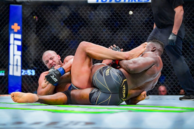 Francis Ngannou and Ciryl Gane compete during their heavyweight title bout at UFC 270. USA TODAY Sports