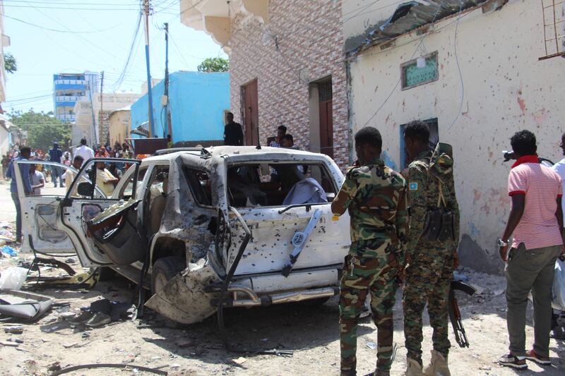 Government soldiers at the scene of suicide bomb attack in Mogadishu on January 16. AFP