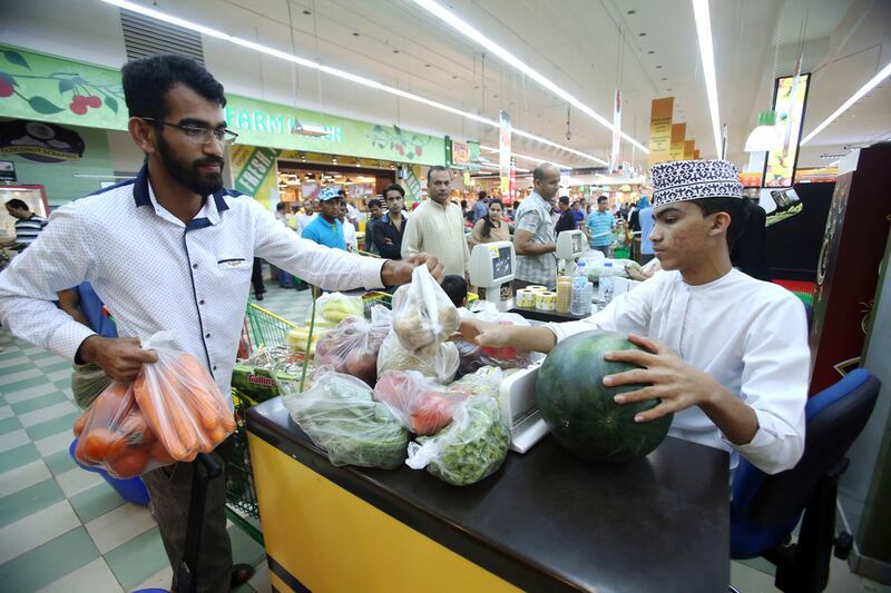 Omanis shop at a supermarket in Muscat. Mohammed Mahjoub / AFP Photo