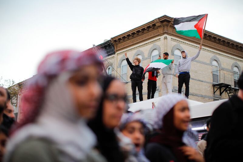 Flags are waved during a rally in support of Palestine in Brooklyn, New York. AFP