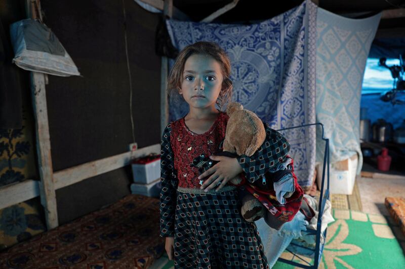 A displaced Syrian child from Idlib stands in a tent at Atmeh camp, near the Turkish border, Syria. Reuters