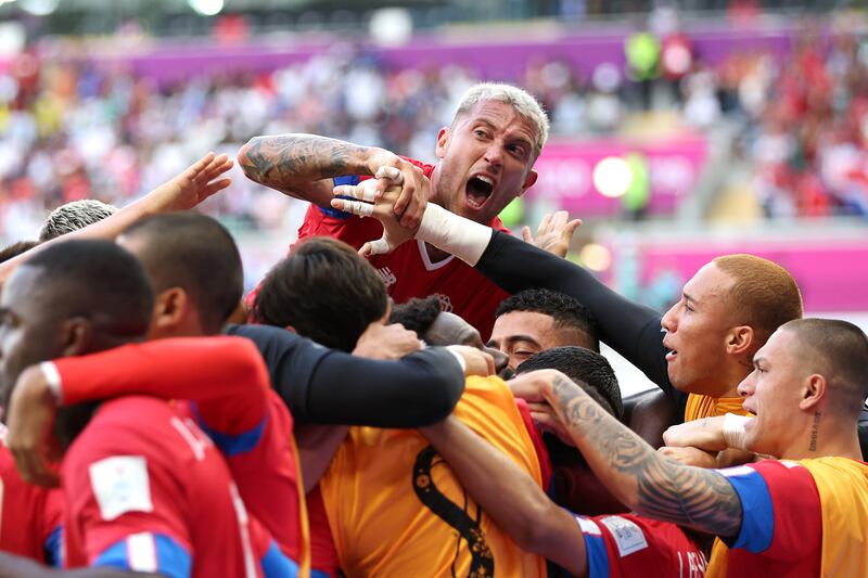 Keysher Fuller of Costa Rica celebrates with teammates after scoring their winner. Getty 