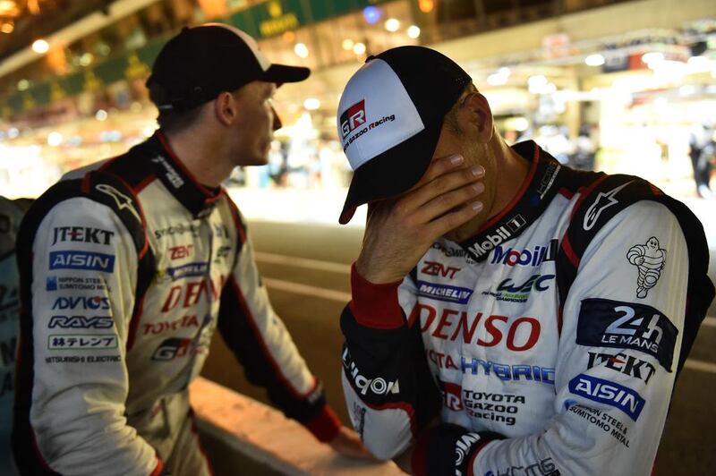 French driver Stephane Sarrazin, right, and English driver Mike Conway react after teammate, Japan’s Kamui Kobayashi in their Toyota TS050 Hybrid abandoned the race. AFP