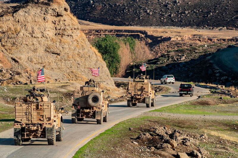 TOPSHOT - A convoy of US armoured vehicles patrols the village of Ein Diwar in Syria's northeastern Hasakeh province on November 4, 2019.  / AFP / Delil SOULEIMAN
