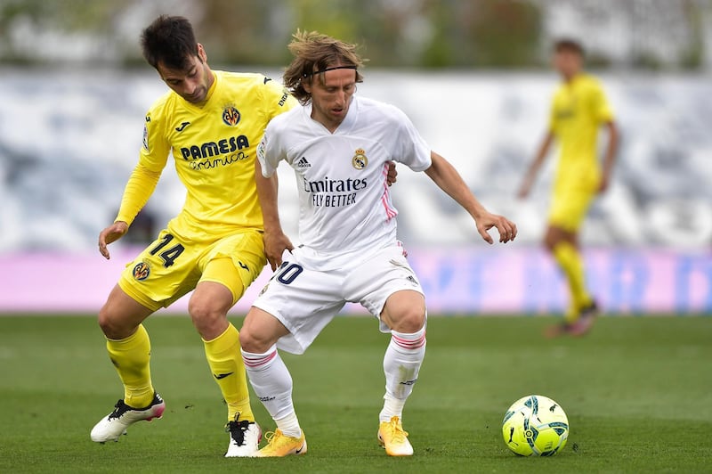 Real Madrid midfielder Luka Modric under pressure from Villarreal's Manu Trigueros. AP