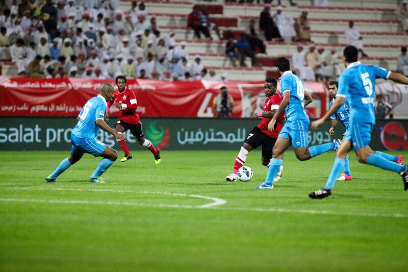 Dubai, UAE, December 6 2012: 

Al Ahli and FC Dibba battled it out tonight at the Rashid Stadium. Al Ahli came out on top, winning 1-0.

Players from Al Ahli (red) and Dibba battle for the ball.



Lee Hoagland/The National
