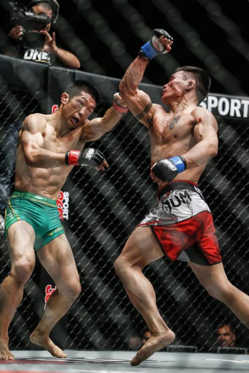 The One Fighting Championship "Reign Of Champions" mixed martial arts tournament held at the Dubai World Trade Center. Narantungalag Jadambaa (Mongolia) beats Koji Oishi (Japan) by judges decision after 5 rounds in the Featherweight World Championship. Antonie Robertson / The National