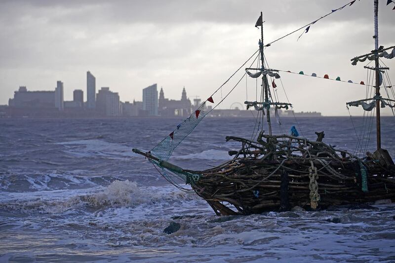 The Pirate Ship art installation, made from driftwood, braves the waves whipped up by the wind of Storm Eleanor. Christopher Furlong / Getty Images