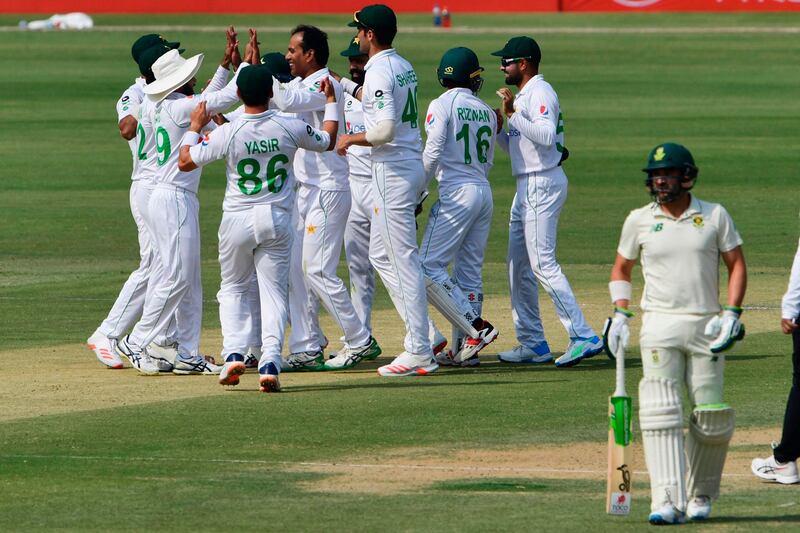 Pakistan celebrate the dismissal of South Africa captain Quinton de Kock. AFP