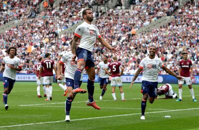 LONDON, ENGLAND - AUGUST 18:  Steve Cook of AFC Bournemouth celebrates scoring his side's second goal with team mates during the Premier League match between West Ham United and AFC Bournemouth at London Stadium on August 18, 2018 in London, United Kingdom.  (Photo by Henry Browne/Getty Images)