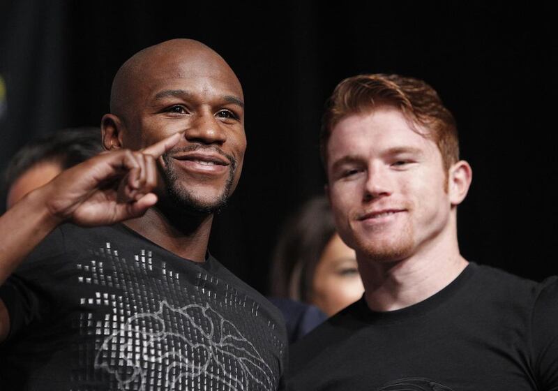 Floyd Mayweather, left, and Saul "Canelo" Alvarez pose during the final news conference Wednesday. The pair are scheduled to fight on Saturday night at Las Vegas for Mayweather's WBA Super World and Alvarez's WBC junior middleweight titles. John Locher / AP Photo