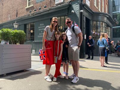 Dylan and Linda Jones with their daughters Lucie, 9, and Summer, 7, at platinum jubilee celebrations outside Buckingham Palace. The National