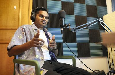 DUBAI,  UNITED ARAB EMIRATES , OCTOBER 7  – 2019 :- Rushdi Rafeek, standup comic, podcaster behind "The Hangout with Rushdi" doing recording in his soundproof room at his home in Dubai Marina in Dubai. ( Pawan Singh / The National ) For Arts. Story by Ann Marie McQueen