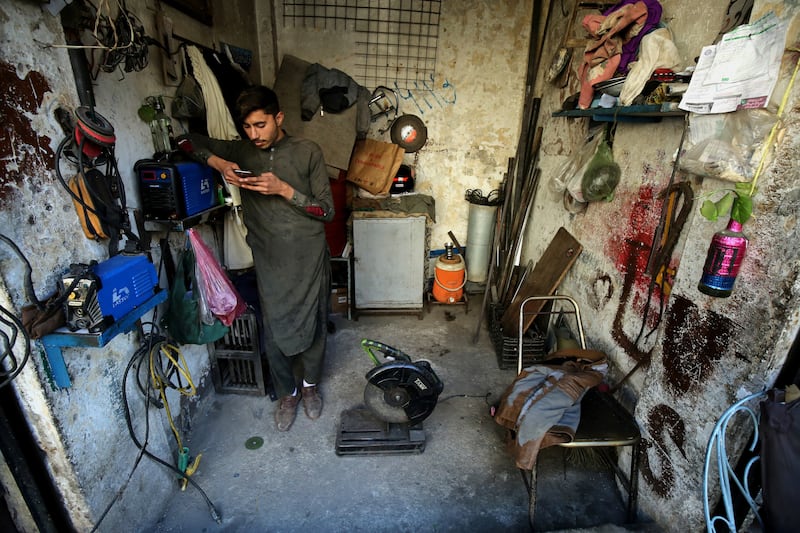 A worker waits for electricity to be restored in Peshawar, north-west Pakistan. Energy Minister Mr Dastgir said it was 'not a major crisis'. EPA