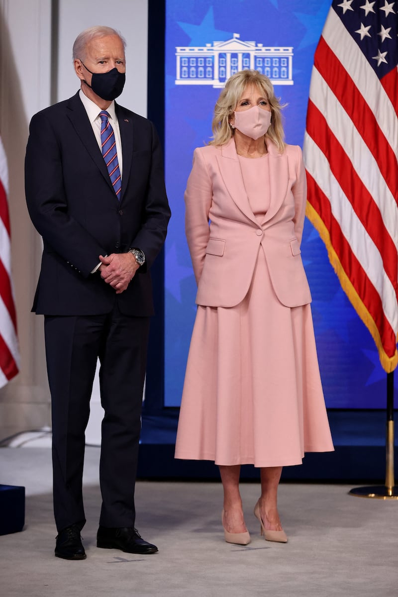 Jill Biden wears a pink co-ordinated dress and jacket to mark Equal Pay Day with President Joe Biden on March 24, 2021 in Washington, DC. Getty Images
