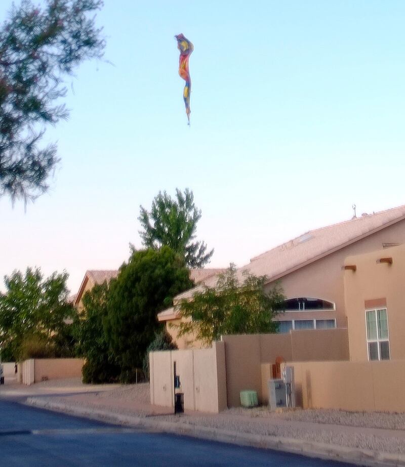 A hot-air balloon envelope falls from the sky near Unser and Central SW in Albuquerque, New Mexico. AP Photo