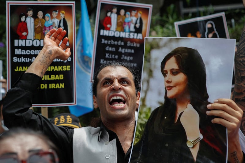 A demonstrator outside the embassy of Iran in Jakarta, Indonesia, protests against the death in police custody of Mahsa Amini. Reuters