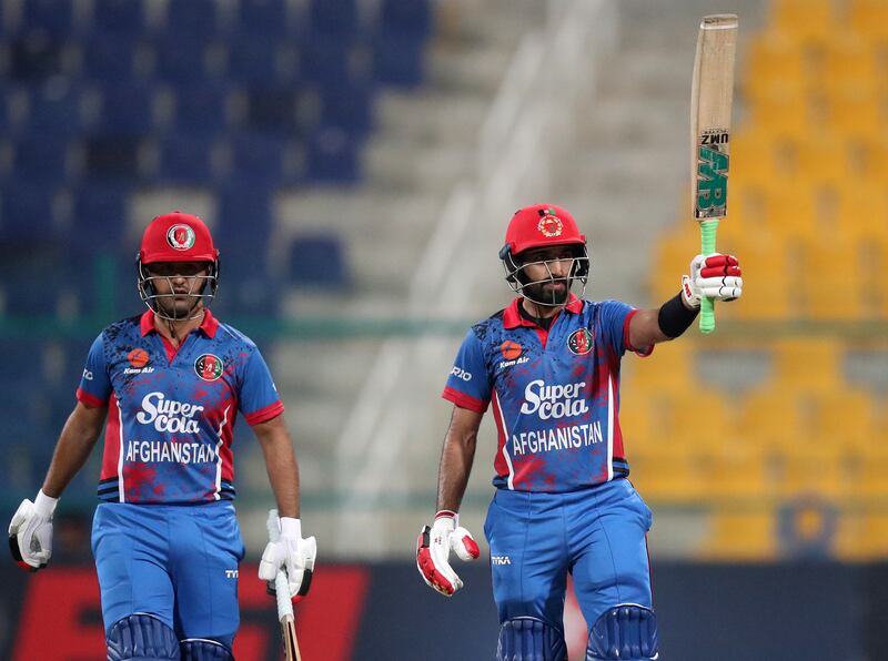 Afghanistan's Karim Janat celebrates reaching his half-century in the first T20 International against the UAE at Zayed Cricket Stadium in Abu Dhabi, on February 16, 2023. Chris Whiteoak / The National