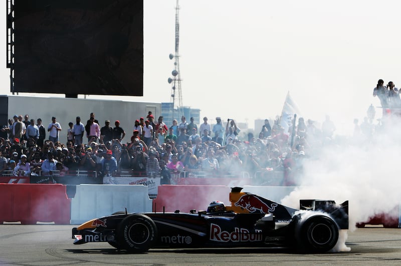 Michael Ammermuller of Red Bull Racing performs burnouts, or doughnuts, on the Abu Dhabi corniche. Getty Images
