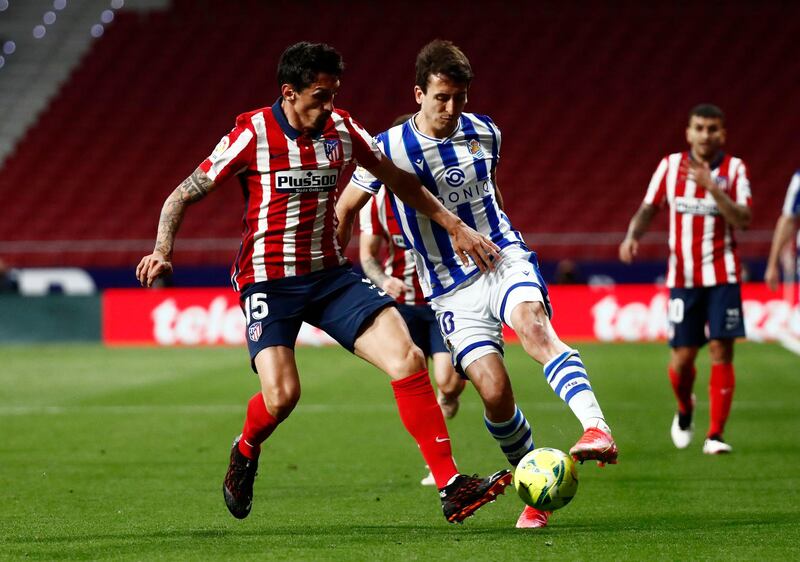 Atletico Madrid's Stefan Savic in action with Real Sociedad's Mikel Oyarzabal. Reuters