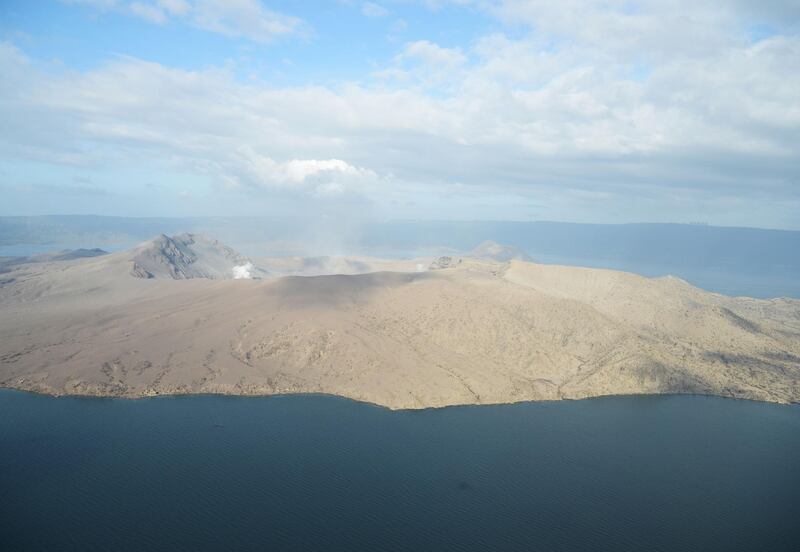 White steam emits from Taal volcano crater as seen from a Philippine airforce helicopter during an aerial survey. Ted Aljibe / AFP