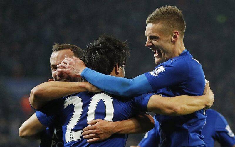 Shinji Okazaki celebrates scoring the first goal for Leicester City with Jamie Vardy and Danny Drinkwater. Action Images via Reuters / John Sibley