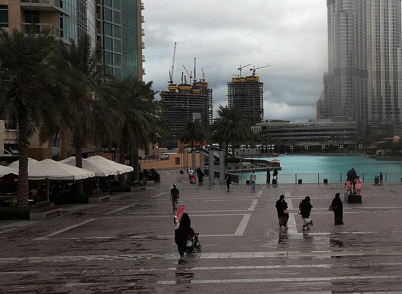 Dubai Police tweeted a warning to drivers on Saturday afternoon, advising motorists to reduce speeds during rain to keep their vehicles from sliding. Satish Kumar / The National