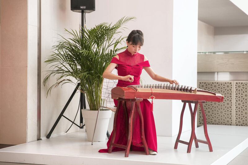 ABU DHABI, UNITED ARAB EMIRATES - JULY 18, 2018. 

A female plays the gzheng as part of UAE-China Week events at Manarat Al Saadiyat in Abu Dhabi, photos show UAE-China strong relationship over the past years.

 A pavilion to celebrate the UAE and Chinese culture was set up at the venue and will be the centerpiece of the UAE-China Week that runs until July 24.

(Photo by Reem Mohammed/The National)

Reporter: 
Section: NA