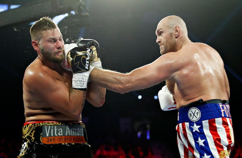 Tyson Fury, of England, lands a left to Tom Schwarz, of Germany, during a heavyweight boxing match in Las Vegas. AP Photo