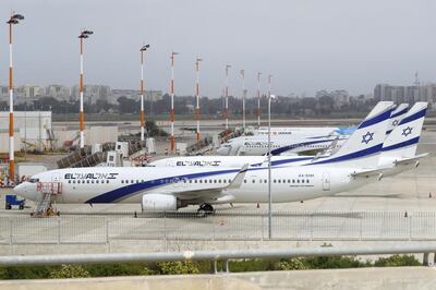 Israel's El Al Airlines Boeing 737 is pictured on the tarmac at Ben Gurion International Airport near Tel Aviv, on March 10, 2020 amid major restrictions on travellers from several countries. - Israel imposed a two-week quarantine on all travellers entering the country, Prime Minister Benjamin Netanyahu said, toughening already significant travel restrictions. (Photo by JACK GUEZ / AFP)