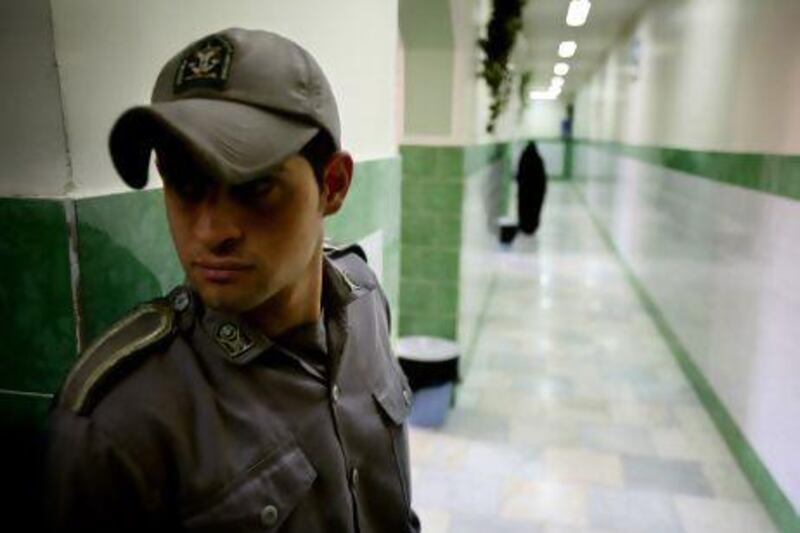 A guard stands along a corridor in Tehran's Evin prison. The prisoner is rarely out of Iranian headlines. It has a roll call of high-profile inmates, among them insiders of the regime caught in the crossfire of its feuding factions. Reuters