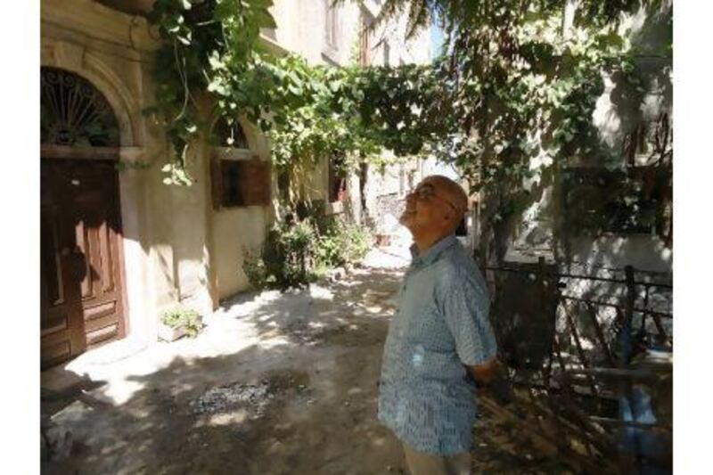 Ashur Etwebi, the poet, translator and physician, on a walk through the old city of Tripoli. Bradley Hope / The National