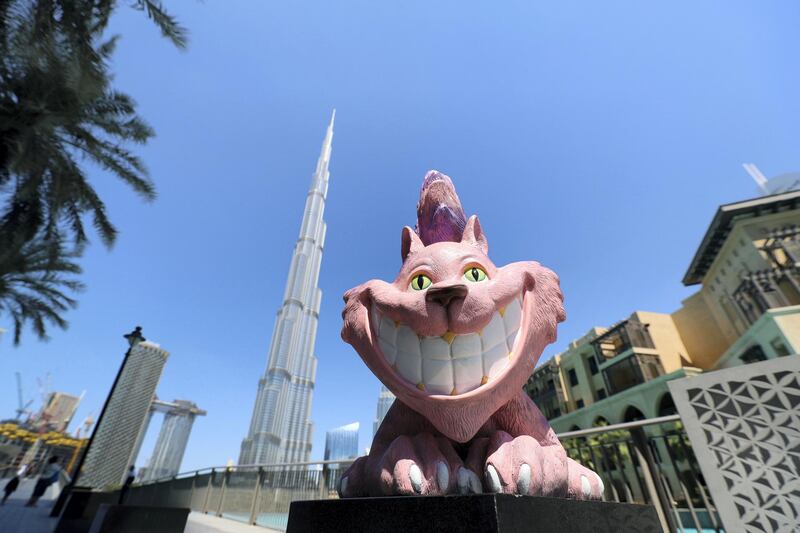 Dubai, United Arab Emirates - April 18, 2019: Photo project. The Cheshire Cat located by the Burj Khalifa. The Propshop has the largest inventory of quality event props in the UAE, individually hand cast and hand painted. 2019. Dubai. Chris Whiteoak / The National