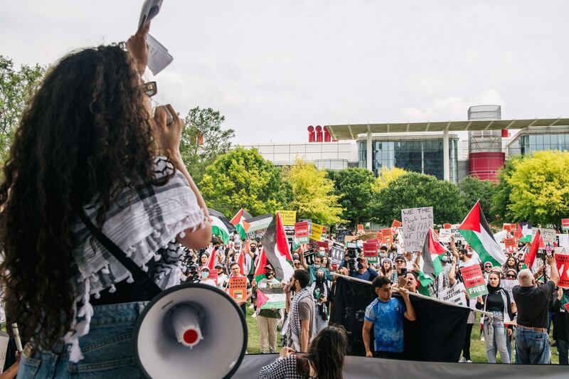 A woman leads a chant at a pro-Palestine demonstration in Houston, Texas. AFP
