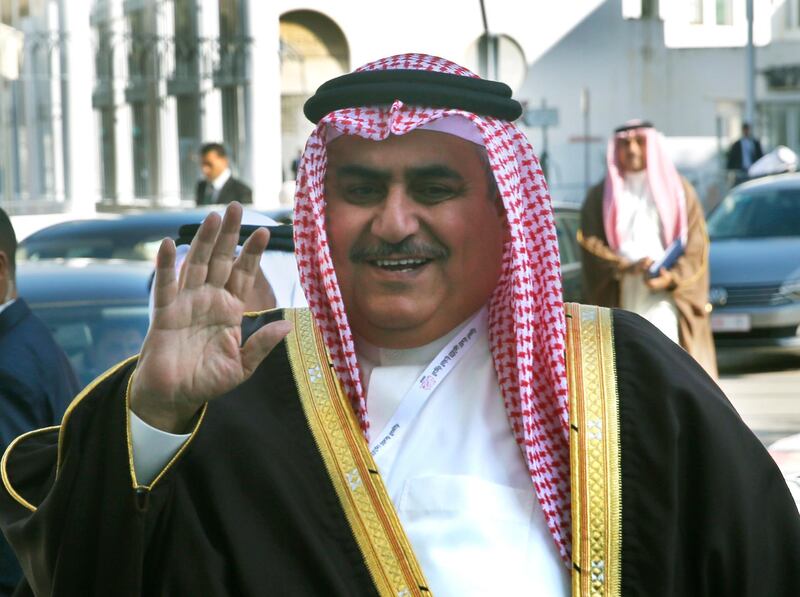 Bahraini Foreign Minister Khalid bin Ahmed Al Khalifa waves to journalists upon his arrival to attend the opening session of the Arab foreign ministers meeting in Tunis. AP Photo