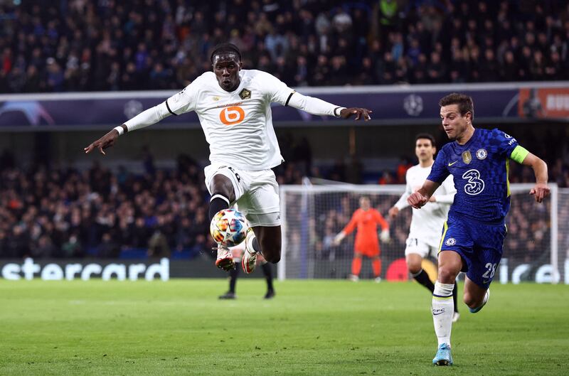 Lille's Amadou Onana in action against Chelsea's Cesar Azpilicueta in last season's Champions League Round of 16. Reuters