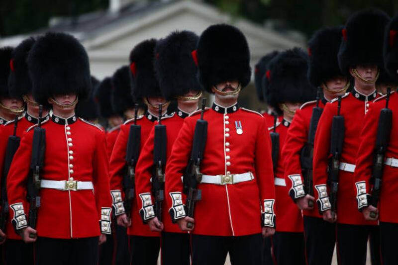 LONDON, ENGLAND - AUGUST 23: Members of the first battalion of Coldstream Guards participate in the Changing of the Guard ceremony at Wellington Barracks on August 23, 2021 in London, England. The event marks the return of one of the city's top tourist attractions which had not been performed since March 2020. (Photo by Hollie Adams / Getty Images)